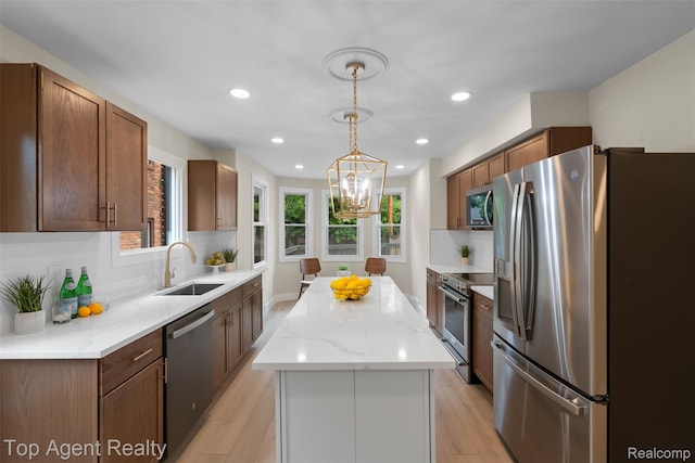 14638 Greenview Rd, Detroit, MI 48223 - kitchen featuring appliances with stainless steel finishes, a center island, tasteful backsplash, a chandelier, and recessed lighting