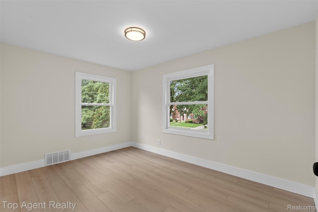 14638 Greenview Rd, Detroit, MI 48223 - spare room featuring healthy amount of natural light and wood finished floors
