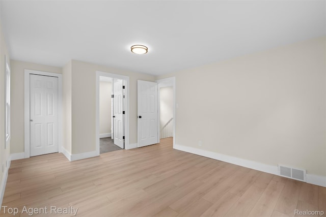 14638 Greenview Rd, Detroit, MI 48223 - unfurnished bedroom featuring light wood-style floors and baseboards