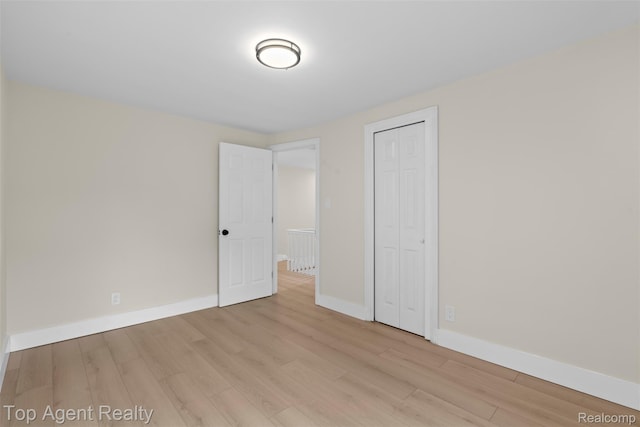 14638 Greenview Rd, Detroit, MI 48223 - unfurnished bedroom with light wood-style floors and a closet