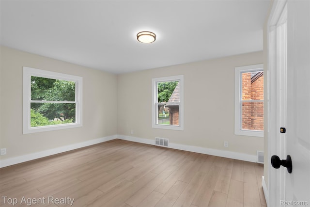 14638 Greenview Rd, Detroit, MI 48223 - empty room with light wood-style floors and baseboards