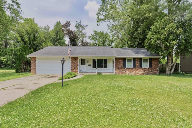 531 Gettysburg Dr, Niles, MI 49120 - ranch-style home with a garage, concrete driveway, brick siding, and a front lawn