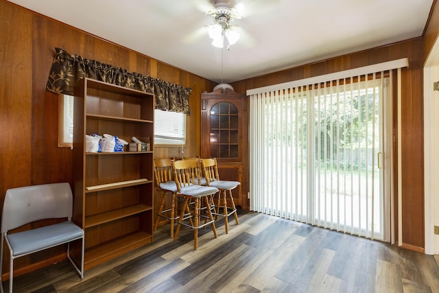 531 Gettysburg Dr, Niles, MI 49120 - dining space featuring ceiling fan, wood walls, and wood finished floors