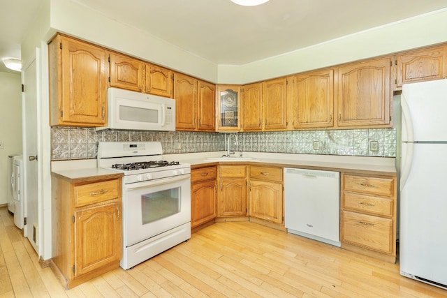 531 Gettysburg Dr, Niles, MI 49120 - kitchen with white appliances, light countertops, light wood-style floors, and washer / clothes dryer