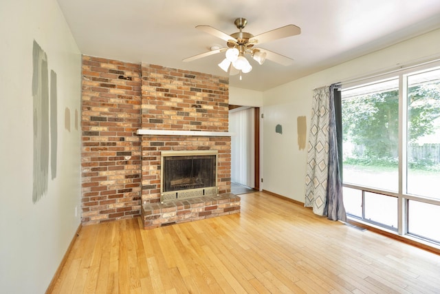 531 Gettysburg Dr, Niles, MI 49120 - unfurnished living room with hardwood / wood-style flooring, ceiling fan, and a fireplace