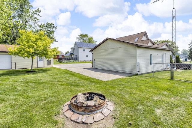 8856 Kingsley Dr, Onsted, MI 49265 - rear view of property with a fire pit and a patio