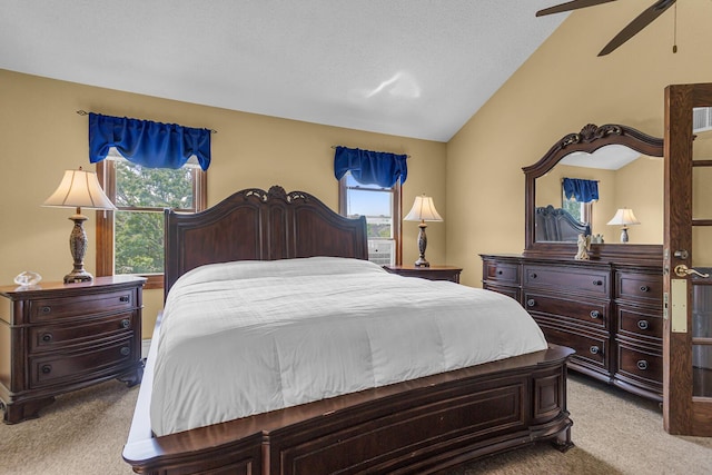 8856 Kingsley Dr, Onsted, MI 49265 - bedroom featuring light colored carpet, multiple windows, lofted ceiling, and a ceiling fan