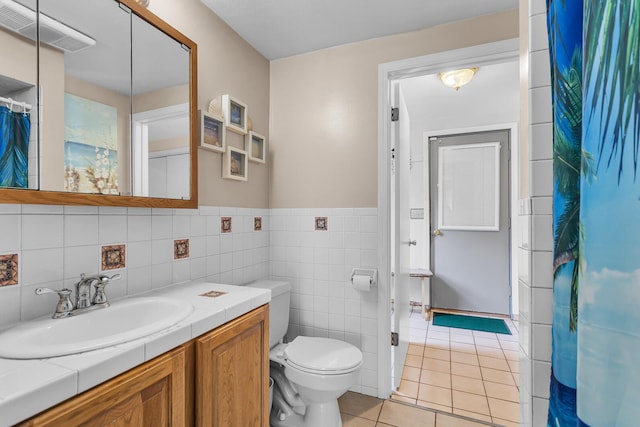 8856 Kingsley Dr, Onsted, MI 49265 - full bath with tile patterned floors, vanity, tile walls, and curtained shower