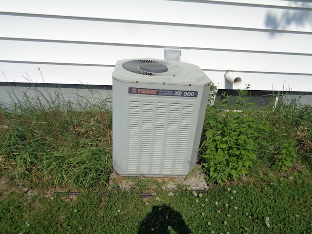 205 Prentiss St, Allen, MI 49227 - exterior view of a central AC unit