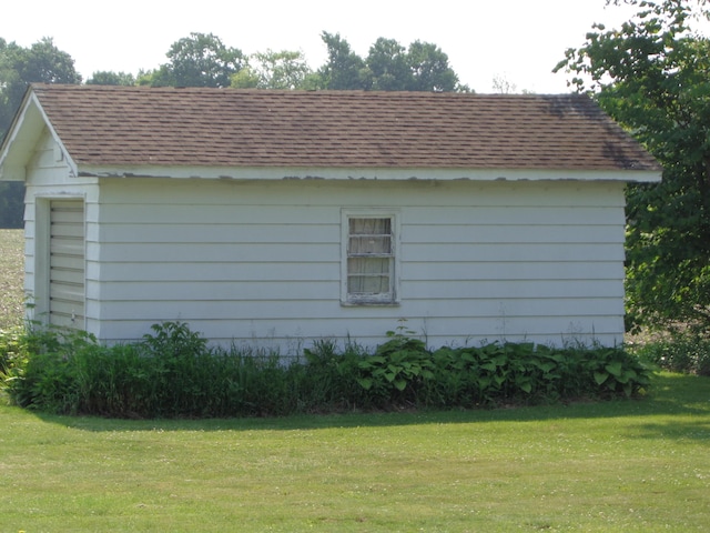205 Prentiss St, Allen, MI 49227 - view of property exterior featuring roof with shingles and a lawn