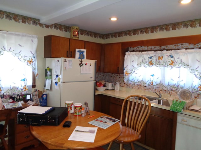 205 Prentiss St, Allen, MI 49227 - kitchen featuring white appliances, decorative backsplash, light countertops, an office area, and brown cabinets
