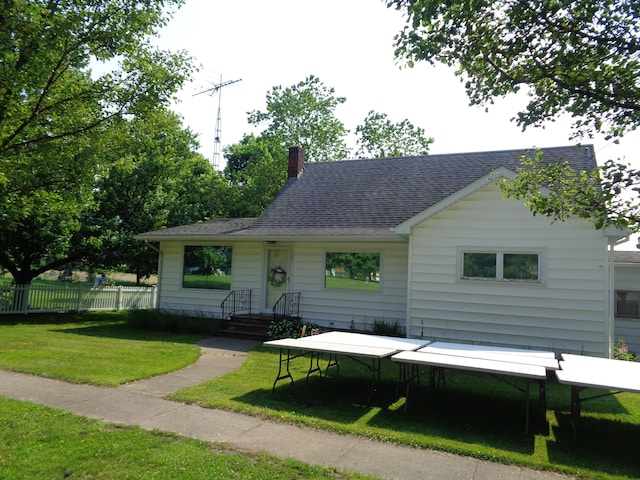 205 Prentiss St, Allen, MI 49227 - view of front of house with roof with shingles and a chimney