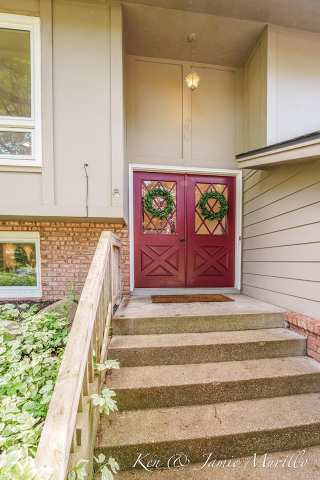 6072 Del Cano Dr SE, Grand Rapids, MI 49546 - property entrance featuring brick siding