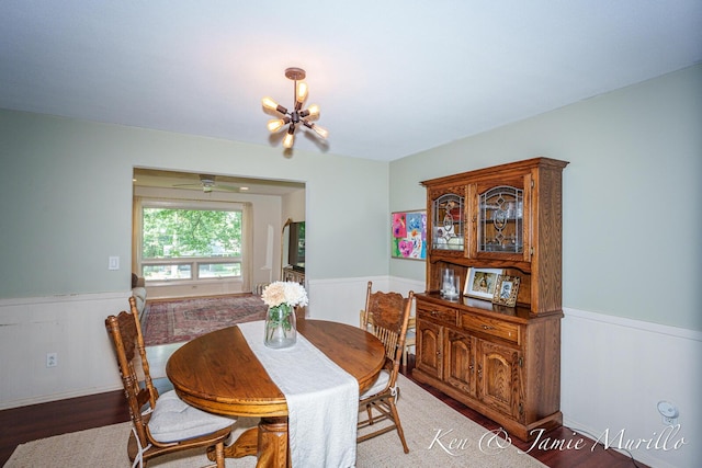 6072 Del Cano Dr SE, Grand Rapids, MI 49546 - dining area with a wainscoted wall, wood finished floors, and a chandelier