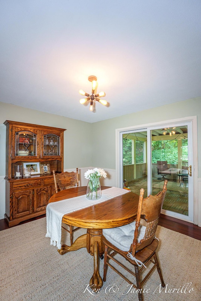 6072 Del Cano Dr SE, Grand Rapids, MI 49546 - dining space with a chandelier and wood finished floors