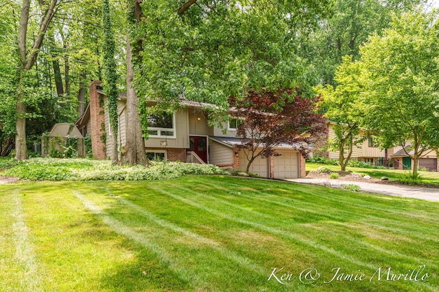 6072 Del Cano Dr SE, Grand Rapids, MI 49546 - view of front of house featuring driveway, a front lawn, brick siding, and a chimney