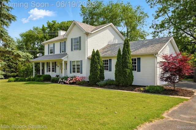 7950 Sandmar Ln, Davisburg, MI 48350 - view of front of home featuring a front yard, roof with shingles, and a chimney