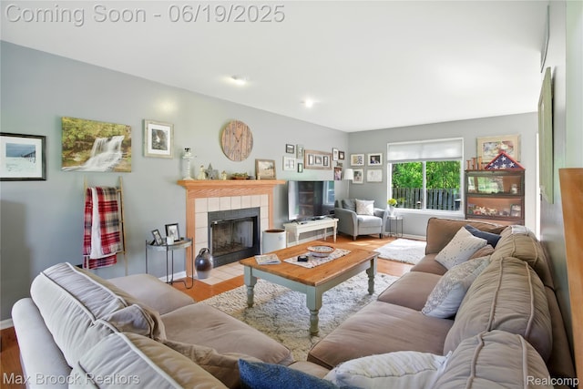 7950 Sandmar Ln, Davisburg, MI 48350 - living room featuring wood finished floors and a tile fireplace
