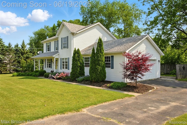 7950 Sandmar Ln, Davisburg, MI 48350 - view of front of house with an attached garage, driveway, and roof with shingles