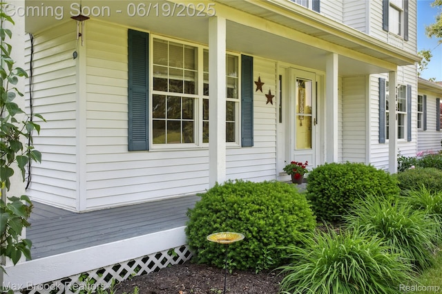 7950 Sandmar Ln, Davisburg, MI 48350 - entrance to property featuring a porch