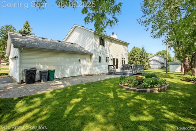 7950 Sandmar Ln, Davisburg, MI 48350 - rear view of property featuring a chimney, a lawn, a wooden deck, and a storage shed