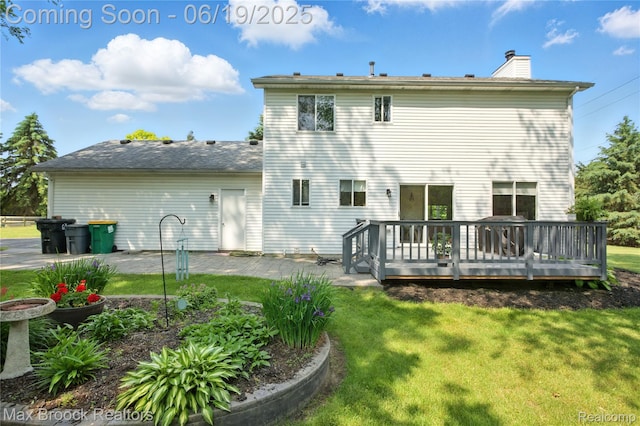 7950 Sandmar Ln, Davisburg, MI 48350 - rear view of house featuring a chimney, a yard, a wooden deck, and a patio area