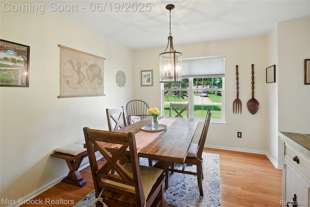 7950 Sandmar Ln, Davisburg, MI 48350 - dining area with light wood finished floors and a chandelier
