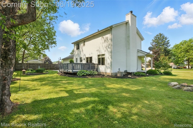 7950 Sandmar Ln, Davisburg, MI 48350 - back of property featuring a chimney and a wooden deck