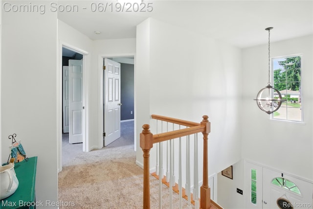 7950 Sandmar Ln, Davisburg, MI 48350 - hall with an upstairs landing, a chandelier, and carpet floors