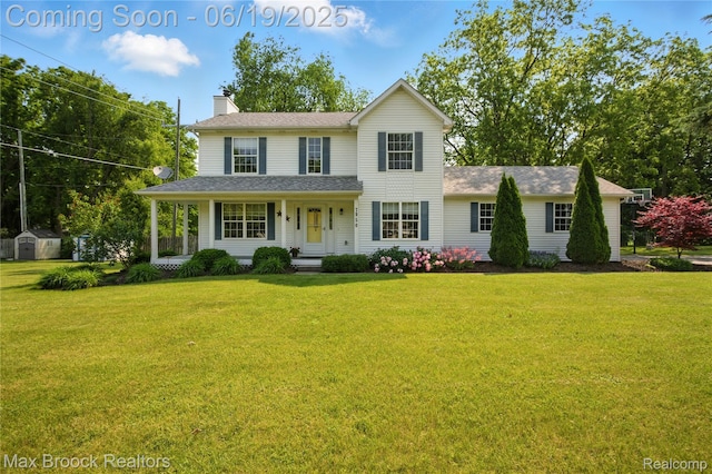 7950 Sandmar Ln, Davisburg, MI 48350 - view of front facade featuring a chimney, a front lawn, a storage shed, and a shingled roof
