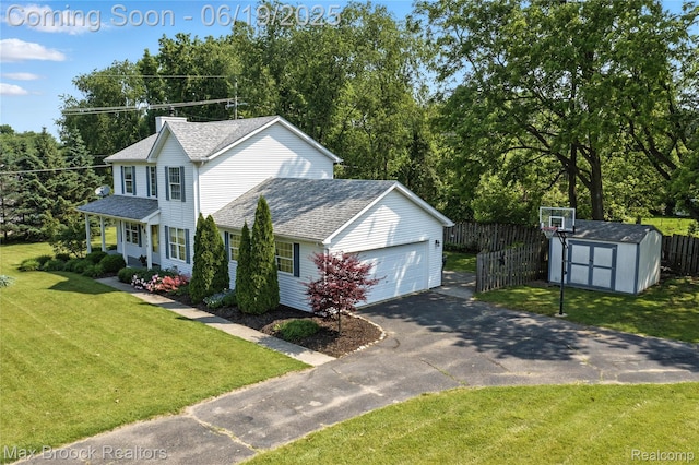 7950 Sandmar Ln, Davisburg, MI 48350 - view of front of property featuring driveway, a storage shed, roof with shingles, and a garage