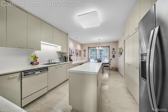 7569 Danbury Cir W, Bloomfield, MI 48322 - kitchen featuring stainless steel fridge, white dishwasher, light countertops, a kitchen island, and a chandelier