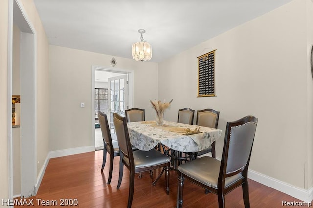 28045 W Greenmeadow Cir, Farmington Hills, MI 48334 - dining space with wood finished floors and a chandelier