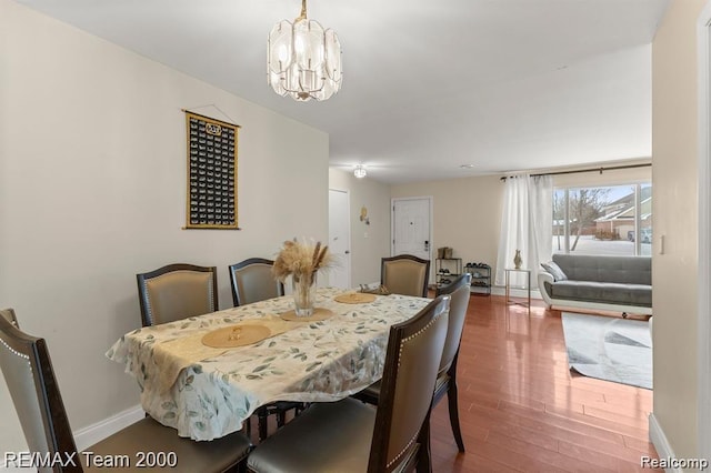 28045 W Greenmeadow Cir, Farmington Hills, MI 48334 - dining space featuring hardwood / wood-style floors and a chandelier