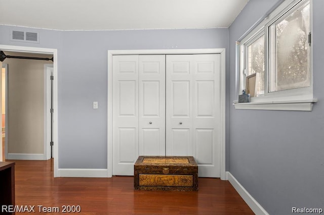 28045 W Greenmeadow Cir, Farmington Hills, MI 48334 - unfurnished bedroom featuring a closet and wood finished floors