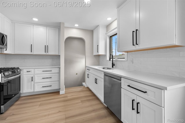 8171 Marian St, Warren, MI 48093 - kitchen with stainless steel appliances, light wood-style floors, light countertops, recessed lighting, and white cabinetry