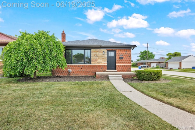 8171 Marian St, Warren, MI 48093 - view of front of home featuring brick siding, a front yard, a chimney, and a shingled roof