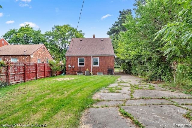 13631 Vassar Ave, Detroit, MI 48235 - back of house with a chimney and brick siding