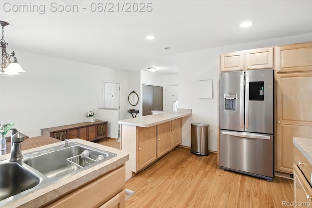 13647 Murthum Ave, Warren, MI 48088 - kitchen featuring stainless steel refrigerator with ice dispenser, light brown cabinets, light wood-type flooring, a peninsula, and light countertops