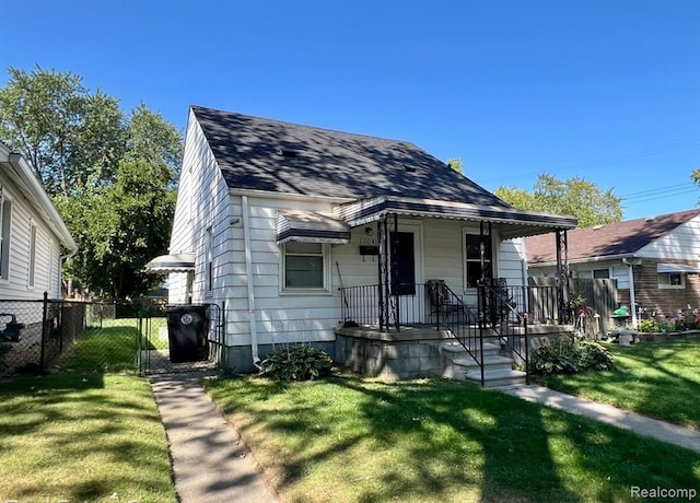17041 Henry St, Melvindale, MI 48122 - bungalow-style house with a porch and a shingled roof