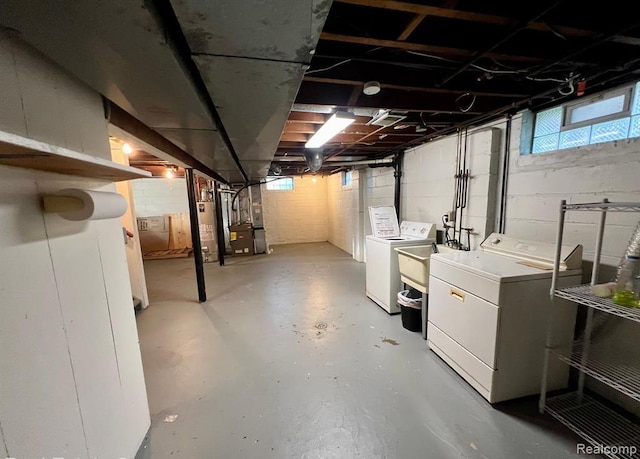 17041 Henry St, Melvindale, MI 48122 - below grade area featuring washing machine and clothes dryer, water heater, and heating unit