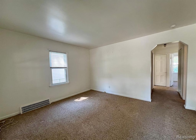 17041 Henry St, Melvindale, MI 48122 - empty room featuring arched walkways and carpet