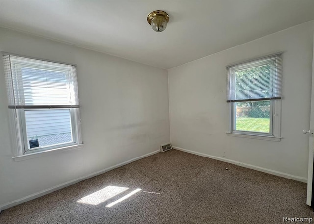 17041 Henry St, Melvindale, MI 48122 - carpeted empty room featuring baseboards