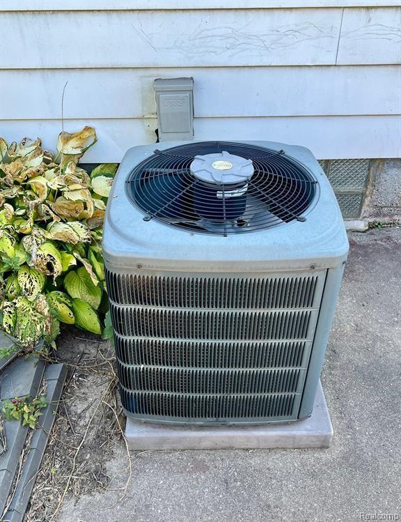 17041 Henry St, Melvindale, MI 48122 - exterior view of a central AC unit and crawl space