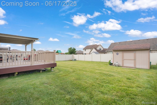 24462 Christian Dr, Flat Rock, MI 48134 - fenced backyard with a storage unit and a deck