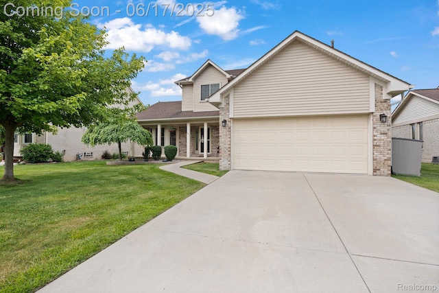 24462 Christian Dr, Flat Rock, MI 48134 - traditional home with driveway, brick siding, a front yard, a garage, and a porch