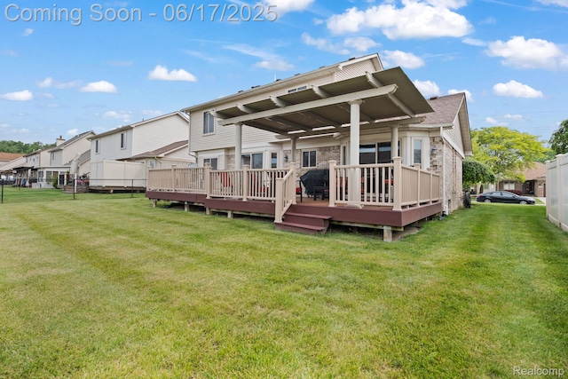 24462 Christian Dr, Flat Rock, MI 48134 - rear view of property featuring a wooden deck, a yard, and a residential view