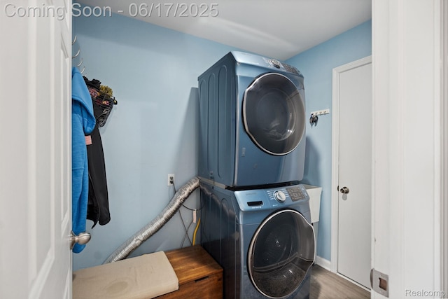 24462 Christian Dr, Flat Rock, MI 48134 - washroom with stacked washer / drying machine and wood finished floors