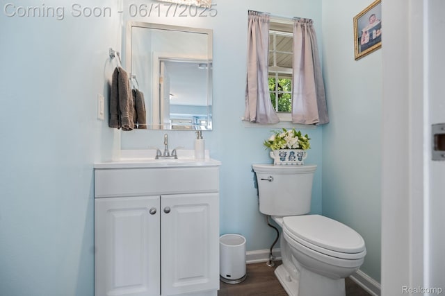 24462 Christian Dr, Flat Rock, MI 48134 - half bathroom featuring vanity and wood finished floors