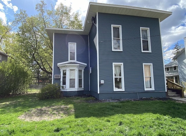 242 Division St, Adrian, MI 49221 - rear view of property with a yard